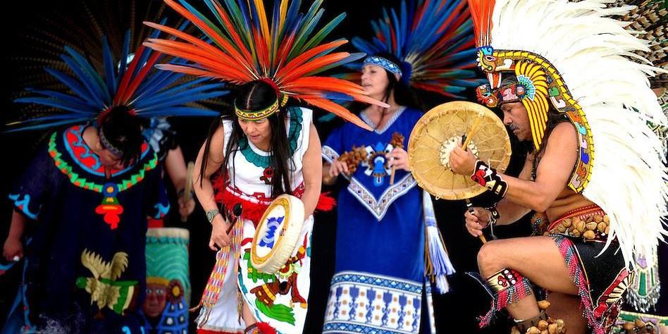 Four native dancers participate in a Cinco de Mayo celebration