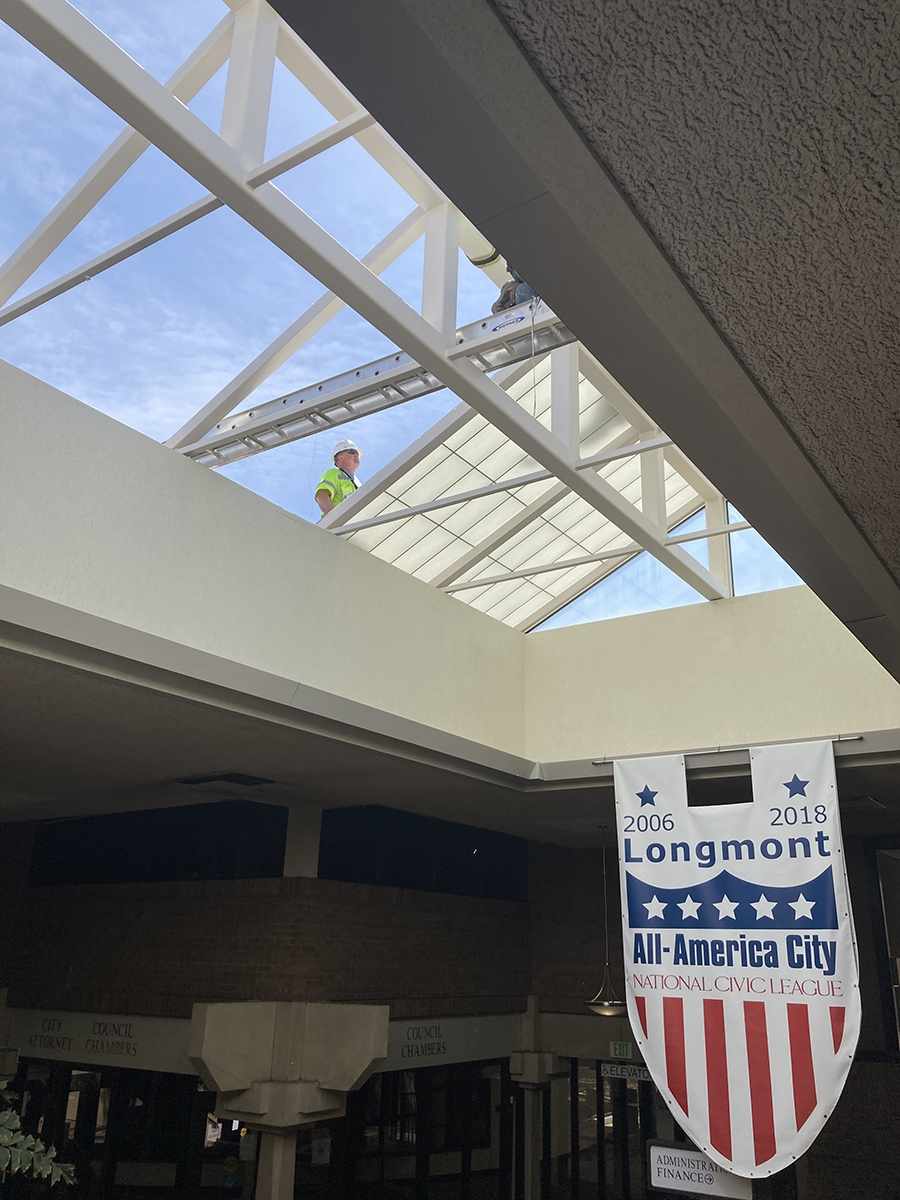 Workmen are installing the new Longmont Civic Center Skylight