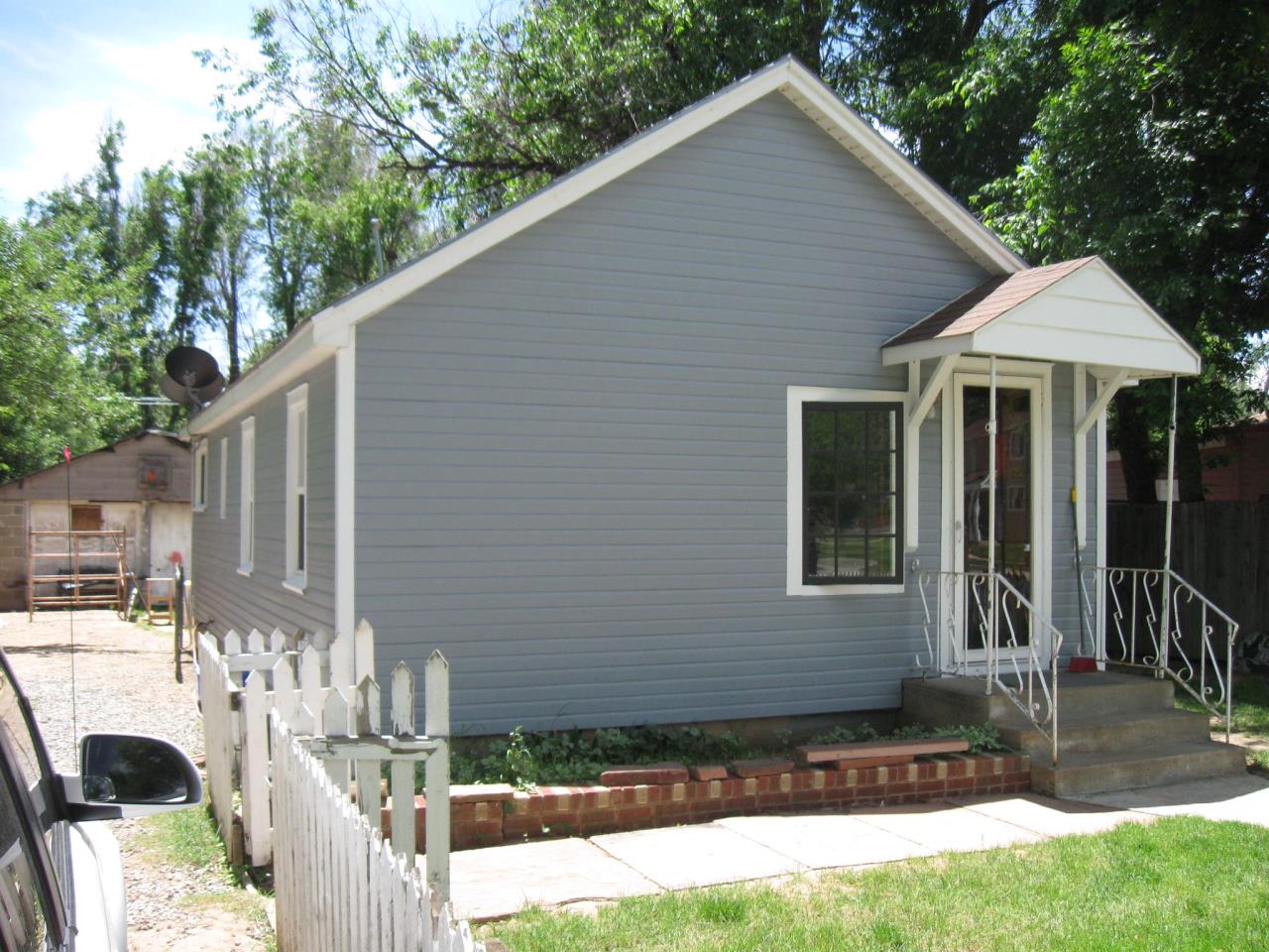 Image of a home with brand-new siding in gray