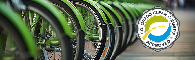 Row of bike wheels in a shallow depth of field with a Dr. COG "Clean Commute Approved" badge on the right.