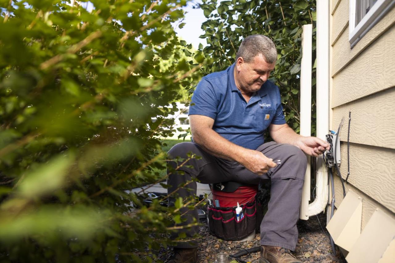 NextLight employee outside a home installing a connection 