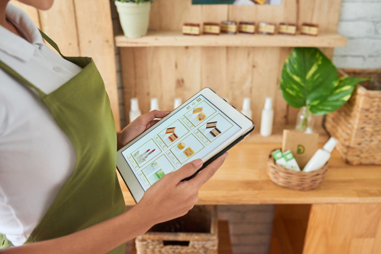 Shop employee holding tablet