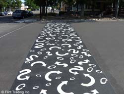 a walkway decorated with arrows in black and white is shown