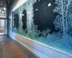 a hallway displaying an etched glass forest scene is shown.