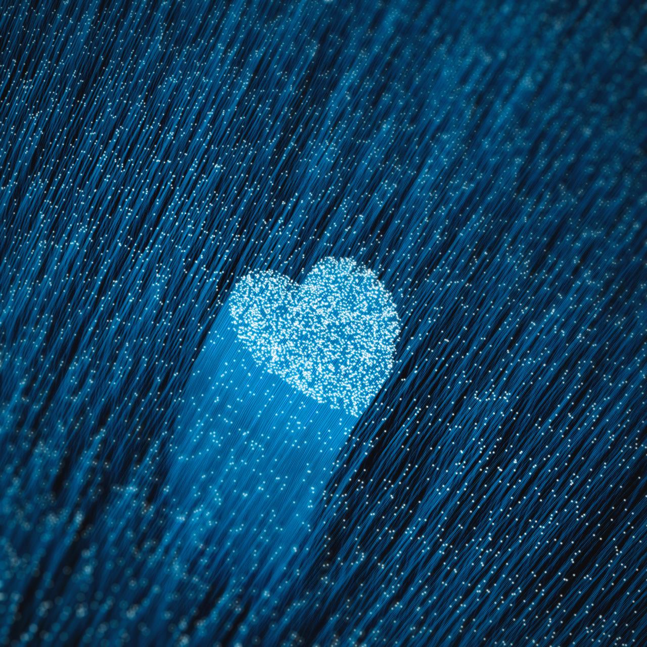 Blue fiber optic strands forming a heart in the middle