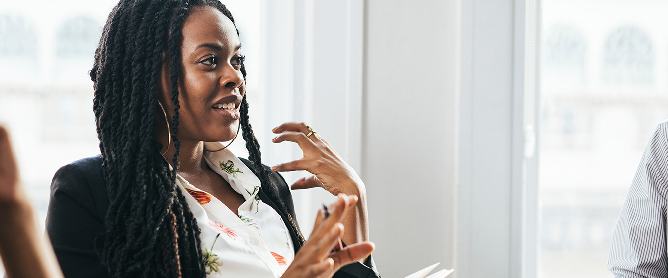 Black female boss talking at a meeting