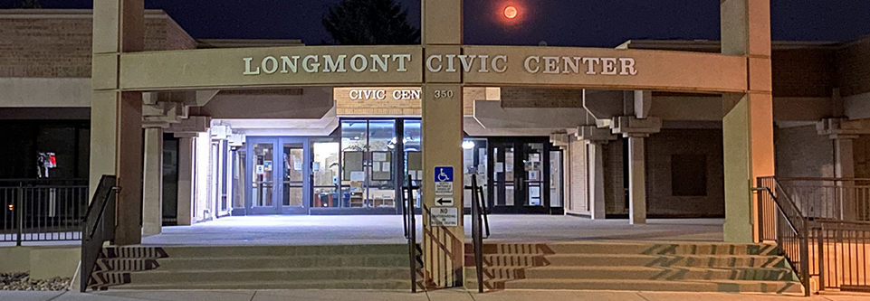 The entrance to the Longmont Civic Center is viewed at night.