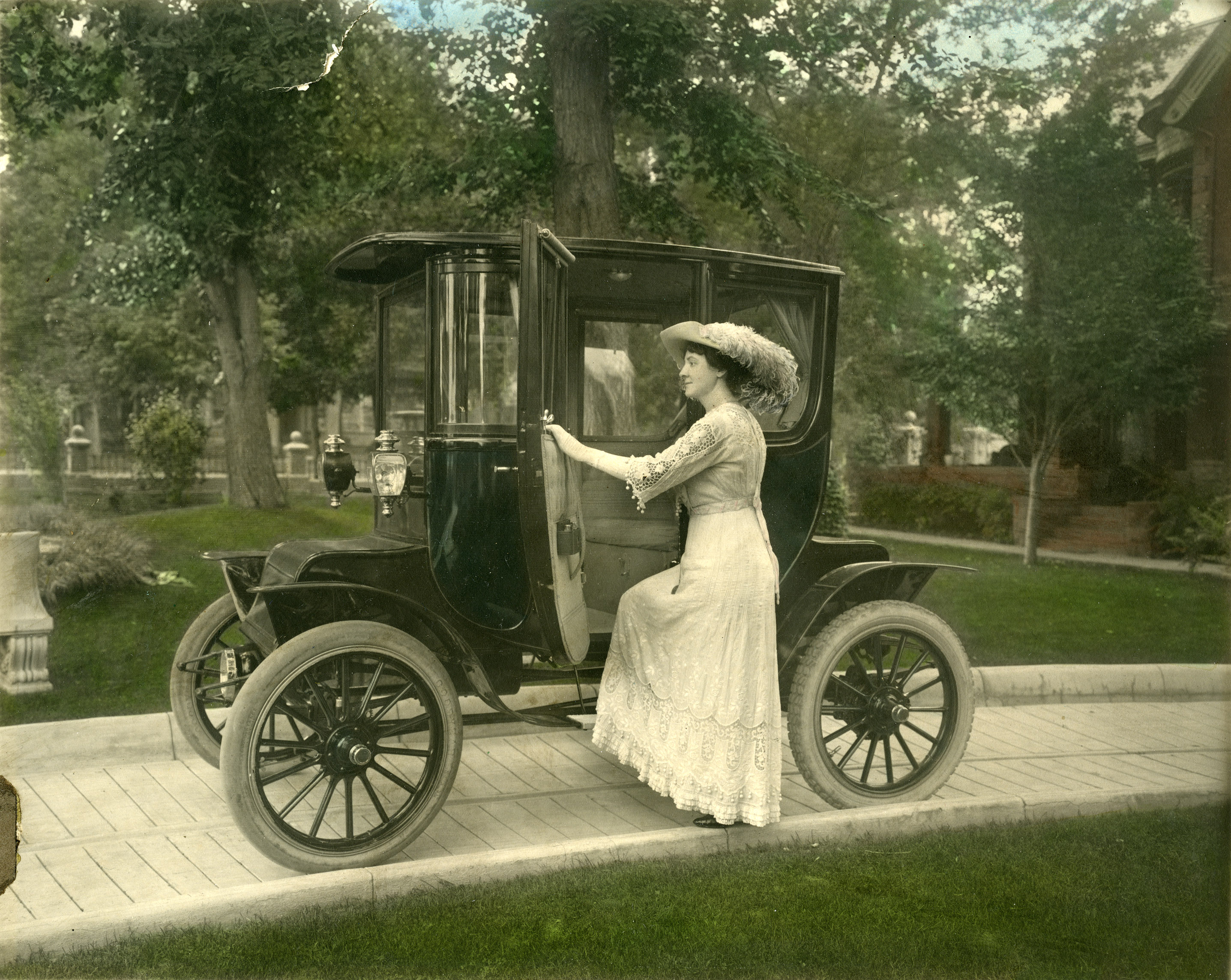 Alice Callahan steps into her Detroit Electric Run-About, c1913 Longmont Museum Photo Archive #1982_019_001