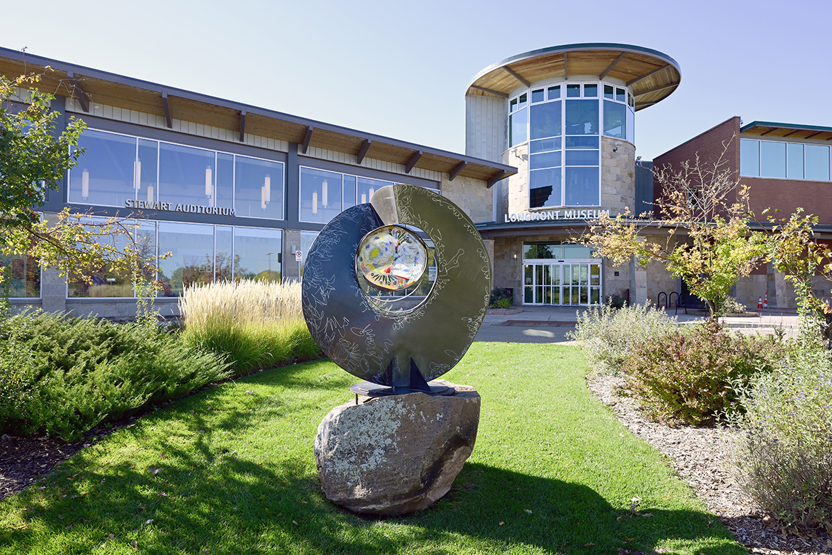 Museum exterior featuring glass windows and a sculpture