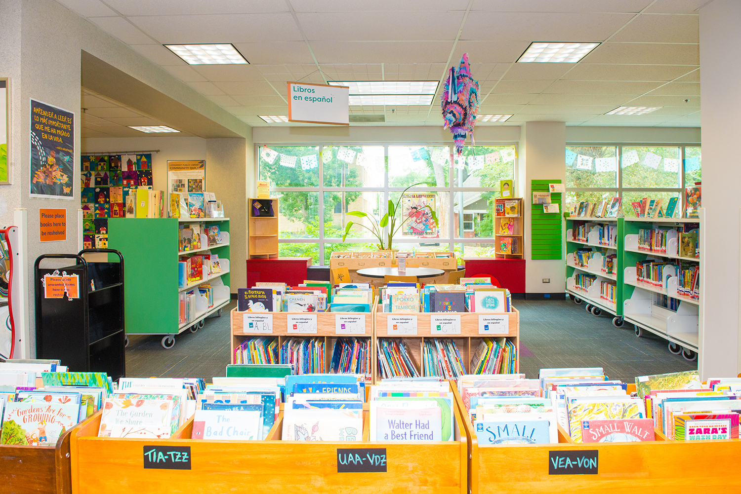 The Children's section of the library features low book shelves and colorful areas